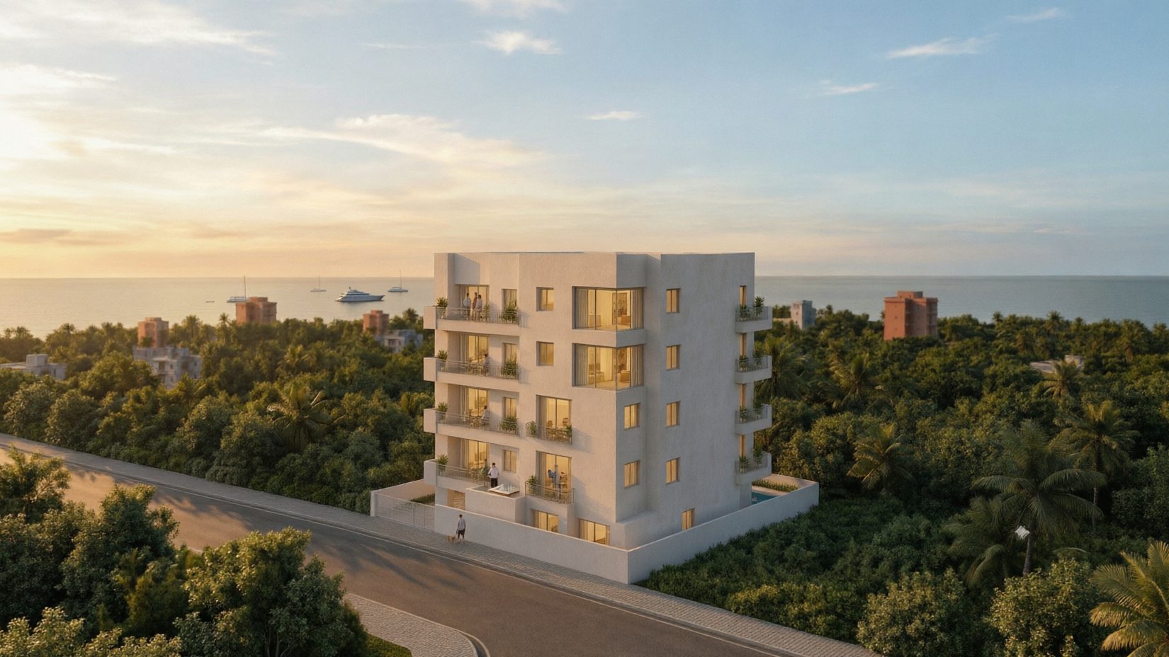 Residencia Cozumel al atardecer: el edificio blanco de terrazas escalonadas entre el palmeral, con el mar al fondo